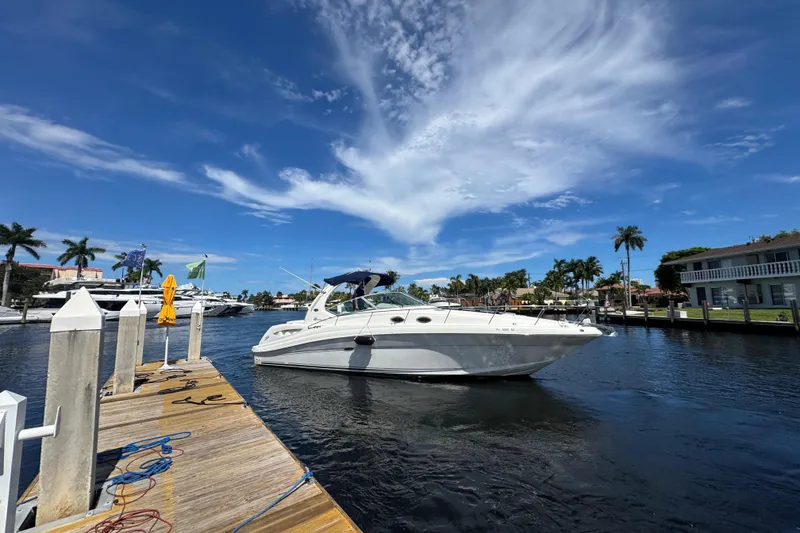 Slide: The Image of Luxurious interior of 2004 Sea Ray 340 Sundancer with elegant seating and decor. - 26