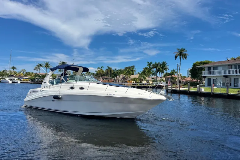 Slide: The Image of Interior of 2004 Sea Ray 340 Sundancer yacht with dining area and kitchenette. - 31