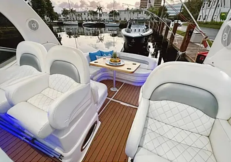 Slide: The Image of 2004 Sea Ray 340 Sundancer boat interior with sink and seating area. - 5