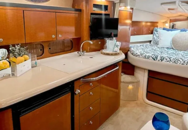 Slide: The Image of Luxury seating on 2004 Sea Ray 340 Sundancer boat with elegant interior design. - 9