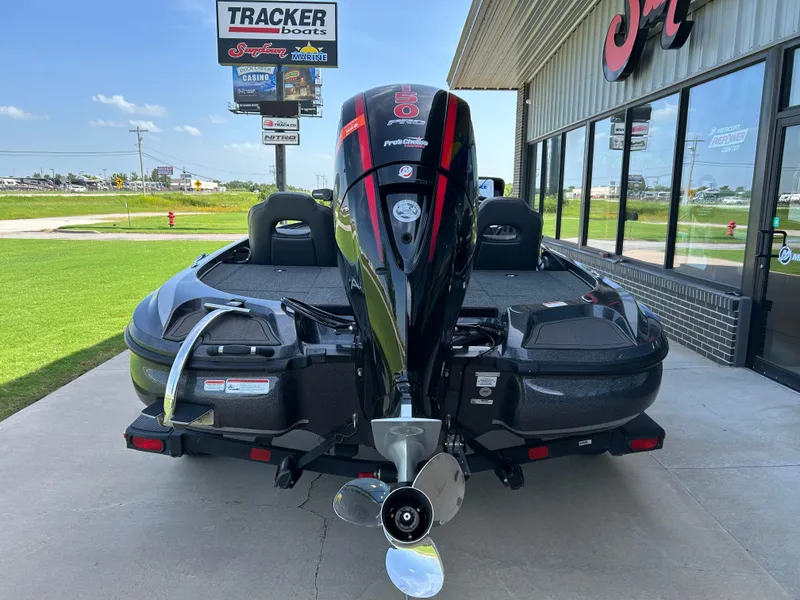 Slide: The Image of 2022 Nitro Z-18 boat with powerful outboard motor, displayed outside a marine dealership. - 1