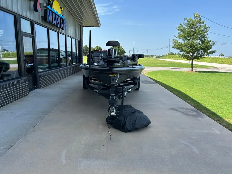 Slide: The Image of 2022 Nitro Z-18 boat parked outside a marine dealership on a sunny day. - 2