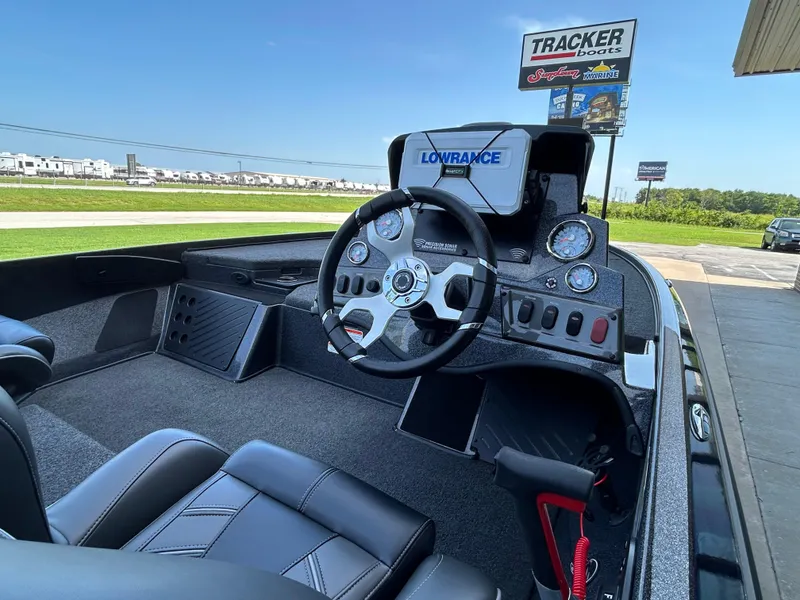 Slide: The Image of Interior of 2022 Nitro Z-18 boat with steering wheel and dashboard controls. - 4