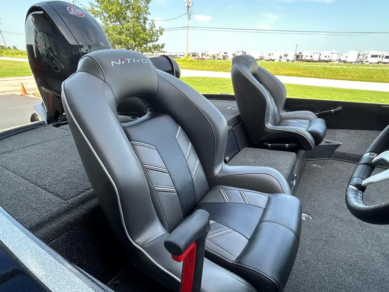 Slide: The Image of 2022 Nitro Z-18 boat interior with black leather seats and steering wheel. - 6