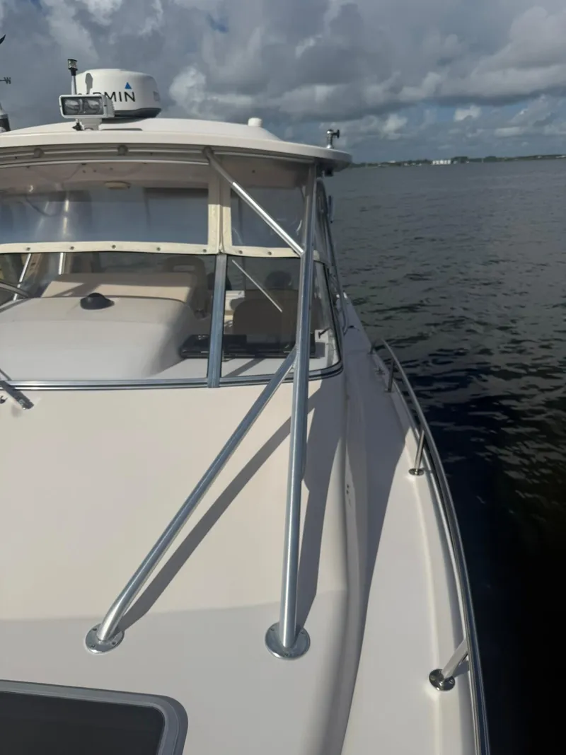 Slide: The Image of 2007 Grady-White Express 330 boat on calm water under cloudy sky. - 18