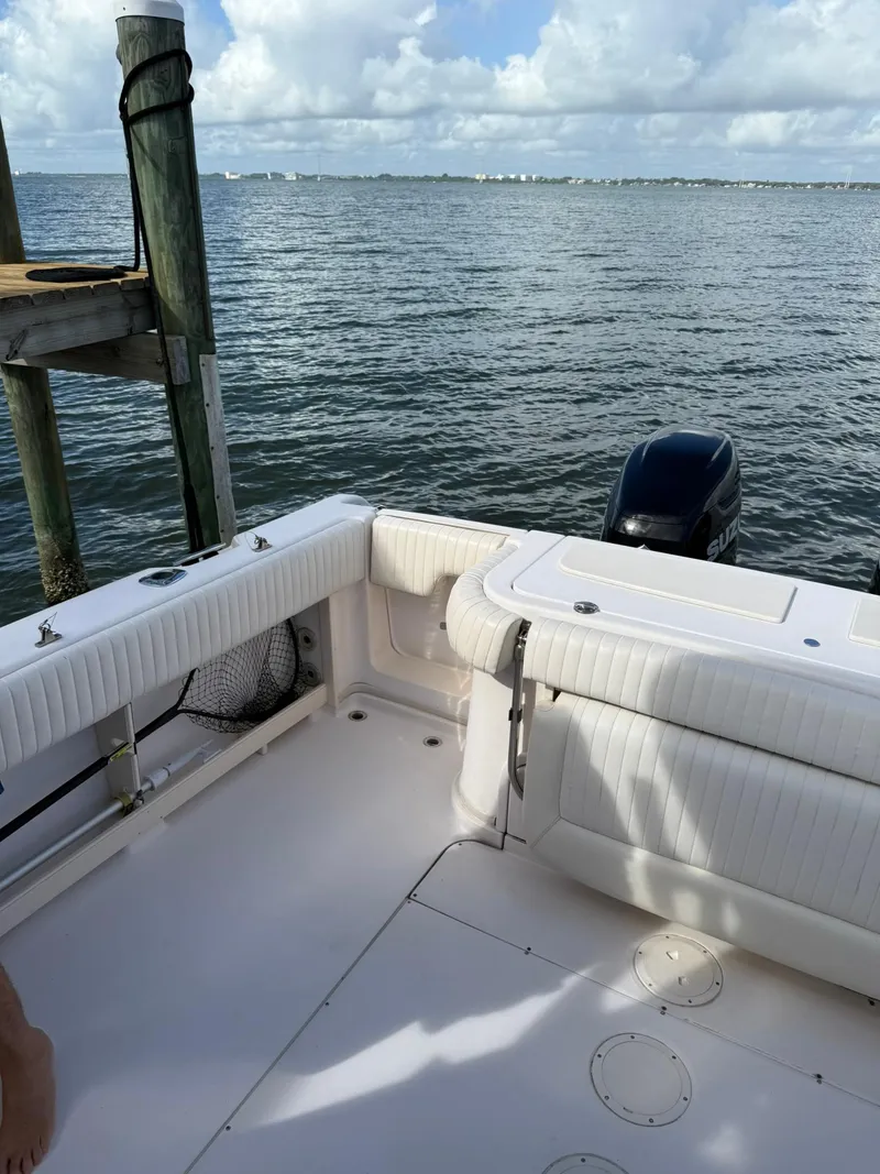 Slide: The Image of 2007 Grady-White Express 330 boat deck with ocean view and Suzuki outboard motor. - 25