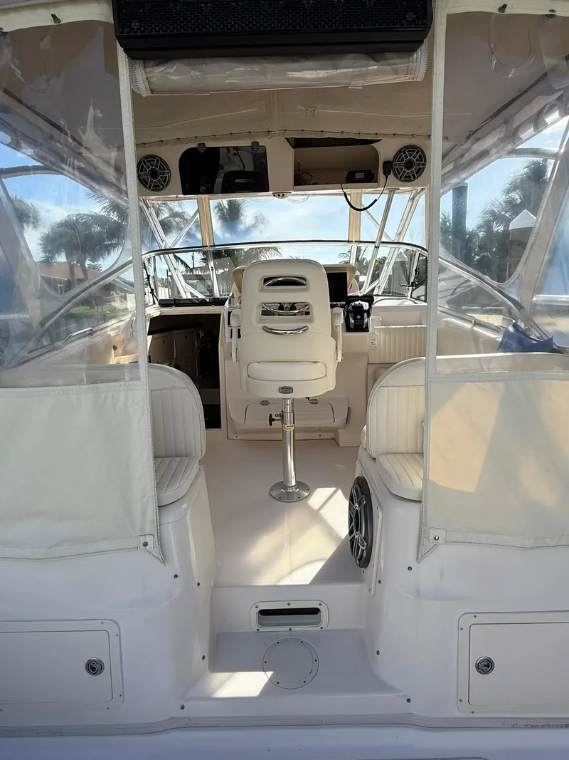 Slide: The Image of 2007 Grady-White Express 330 boat interior with helm and seating area. - 27