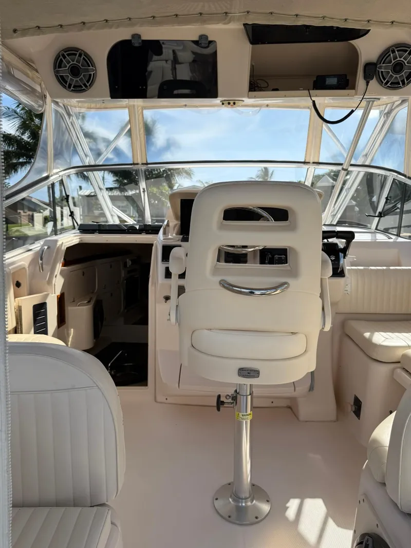 Slide: The Image of 2007 Grady-White Express 330 boat interior with helm seat and dashboard. - 31
