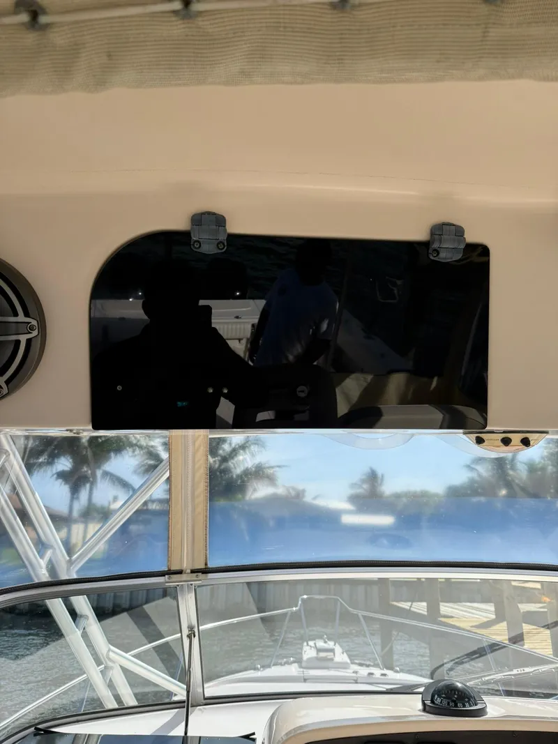 Slide: The Image of 2007 Grady-White Express 330 boat interior with dashboard and water view. - 39