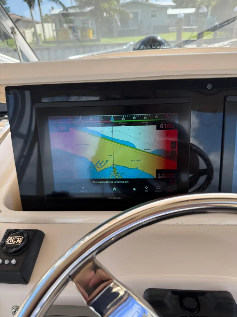 Slide: The Image of 2007 Grady-White Express 330 helm with Garmin navigation display. - 45