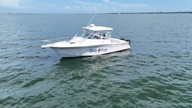 Slide: The Image of 2007 Grady-White Express 330 boat on open water, clear sky background. - 6