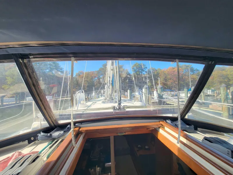 Slide: The Image of View from the cockpit of a 2003 Caliber 40 LRC SE sailboat in a marina. - 11