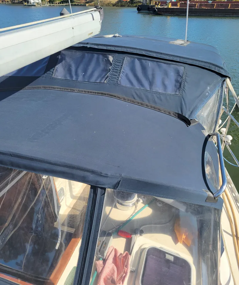 Slide: The Image of 2003 Caliber 40 LRC SE sailboat with blue canvas cover on deck. - 13