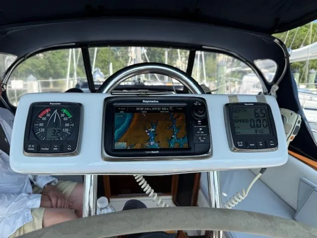 Slide: The Image of Caliber 40 LRC SE 2003 yacht cockpit with navigation instruments and steering wheel. - 14