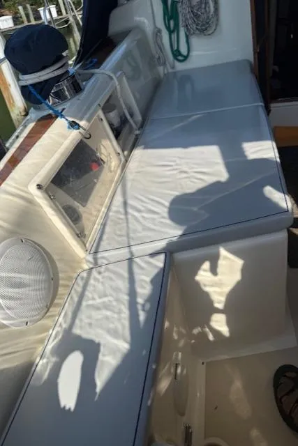 Slide: The Image of Interior view of a 2003 Caliber 40 LRC SE sailboat with seating and storage. - 17