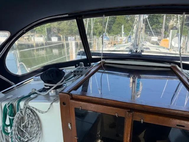 Slide: The Image of Interior view of 2003 Caliber 40 LRC SE sailboat cockpit with marina background. - 19