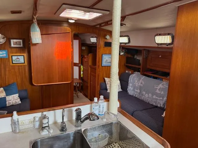 Slide: The Image of Interior of 2003 Caliber 40 LRC SE yacht with cozy seating and wooden finishes. - 26