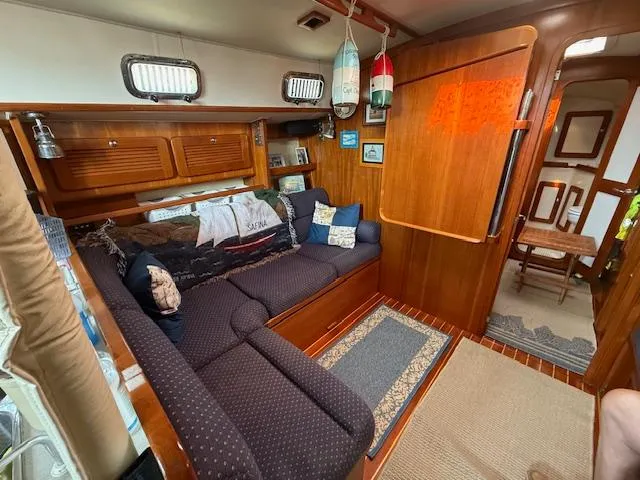 Slide: The Image of Cozy interior of 2003 Caliber 40 LRC SE sailboat with wooden furnishings and seating area. - 29