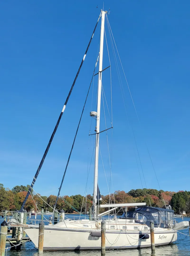 Slide: The Image of 2003 Caliber 40 LRC SE sailboat docked under clear blue sky. - 3