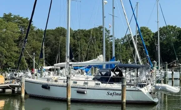 Slide: The Image of Sailboat Caliber 40 LRC SE 2003 docked at marina with trees in background. - 4