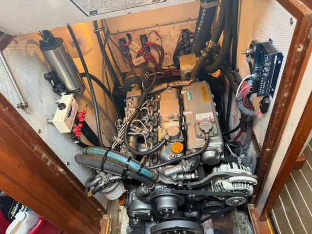 Slide: The Image of Engine compartment of a 2003 Caliber 40 LRC SE sailboat, showing detailed mechanical components. - 44