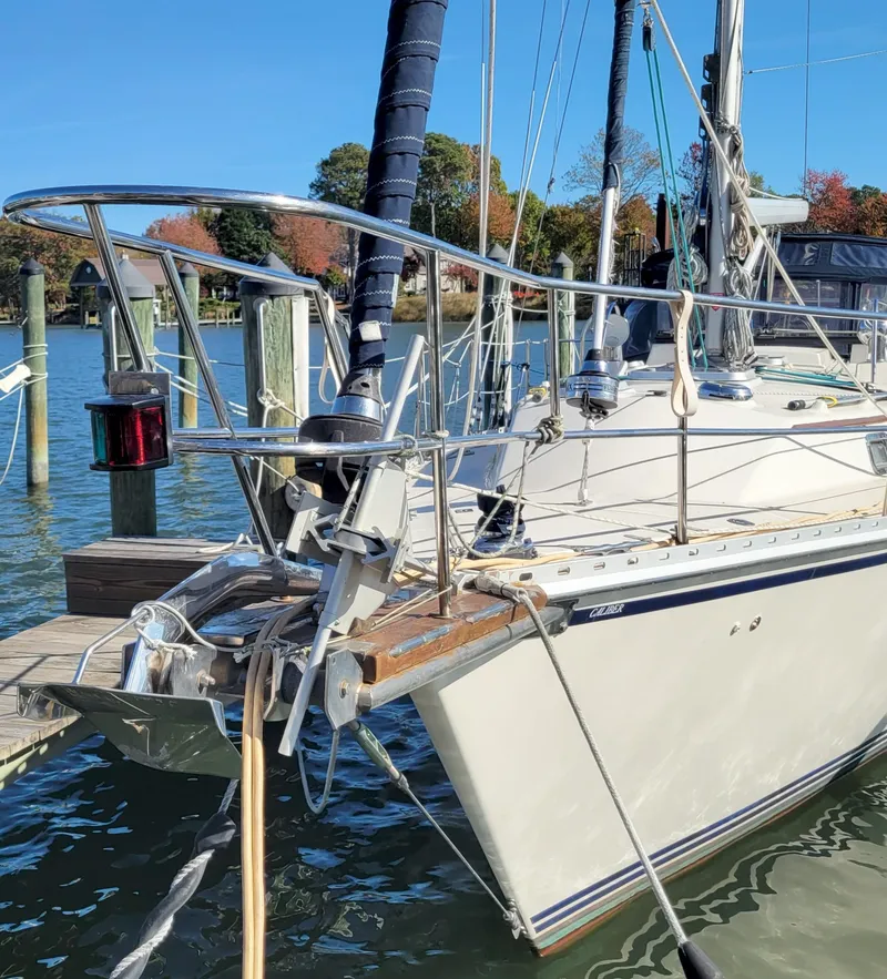 Slide: The Image of Sailboat Caliber 40 LRC SE 2003 docked at marina, clear blue sky. - 5