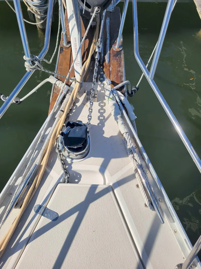 Slide: The Image of Bow of 2003 Caliber 40 LRC SE sailboat with anchor chain and ropes. - 7