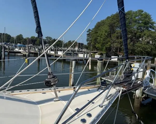 Slide: The Image of Sailboat docked at marina, Caliber 40 LRC SE, 2003 model, with clear blue sky. - 8