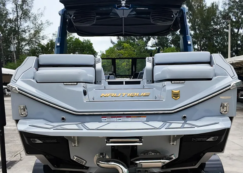 Slide: The Image of 2025 Nautique G23 Paragon boat rear view, showcasing sleek design and luxury features. - 22