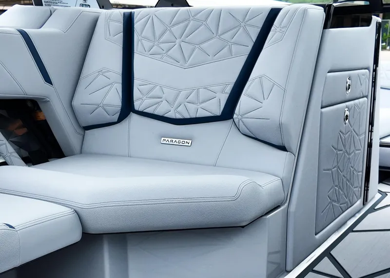 Slide: The Image of 2025 Nautique G23 Paragon boat interior with geometric-patterned seating. - 5