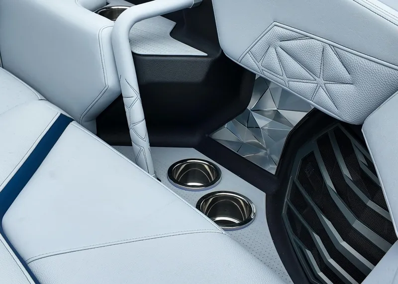 Slide: The Image of 2025 Nautique G23 Paragon interior with luxurious seating and cup holders. - 8