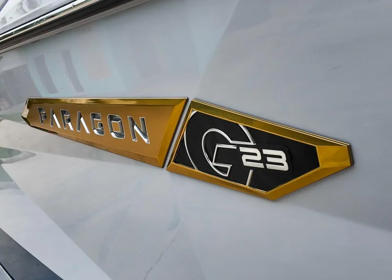 Slide: The Image of 2025 Nautique G23 Paragon logo on sleek boat exterior. - 9