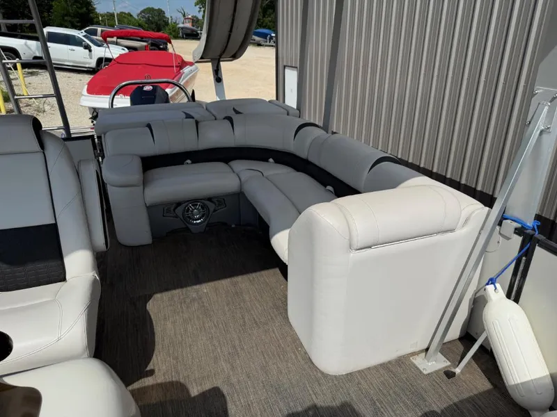 Slide: The Image of Luxurious seating on a 2022 Avalon 2585 CR pontoon boat, featuring plush white upholstery. - 10