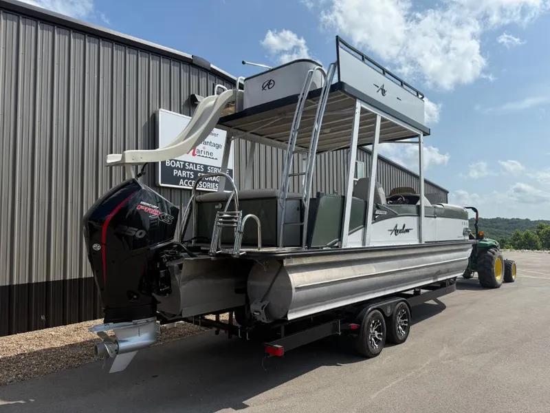 Slide: The Image of 2022 Avalon 2585 CR pontoon boat with Mercury 150 engine on trailer. - 3