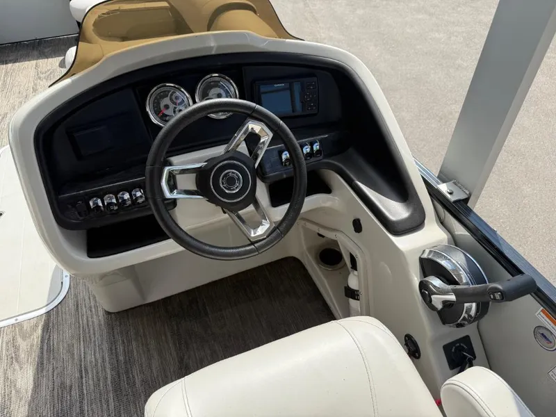 Slide: The Image of 2022 Avalon 2585 CR boat dashboard with steering wheel and control panel. - 9