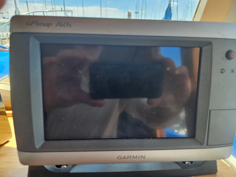 Slide: The Image of Garmin GPSmap 140s on 1973 Grand Banks 36 Classic boat dashboard. - 18