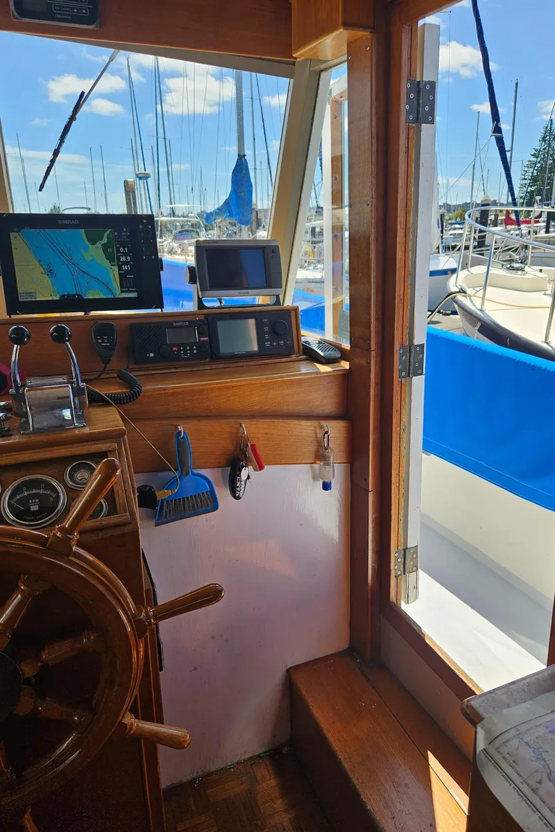 Slide: The Image of Interior view of a 1973 Grand Banks 36 Classic boat with navigation equipment. - 6