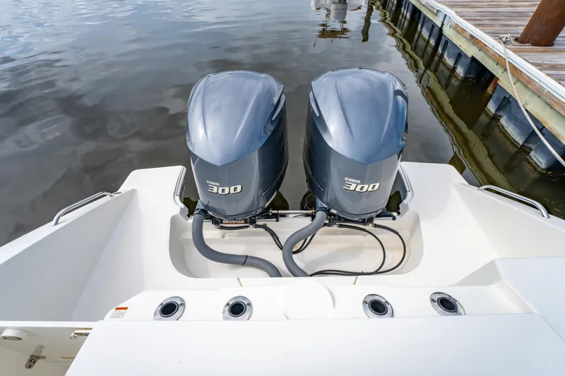 Slide: The Image of 2021 Pursuit S 288 Sport boat with twin Yamaha 300 outboard engines at dock. - 28
