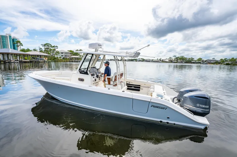 Slide: The Image of 2021 Pursuit S 288 Sport boat on calm water with Yamaha engines. - 3