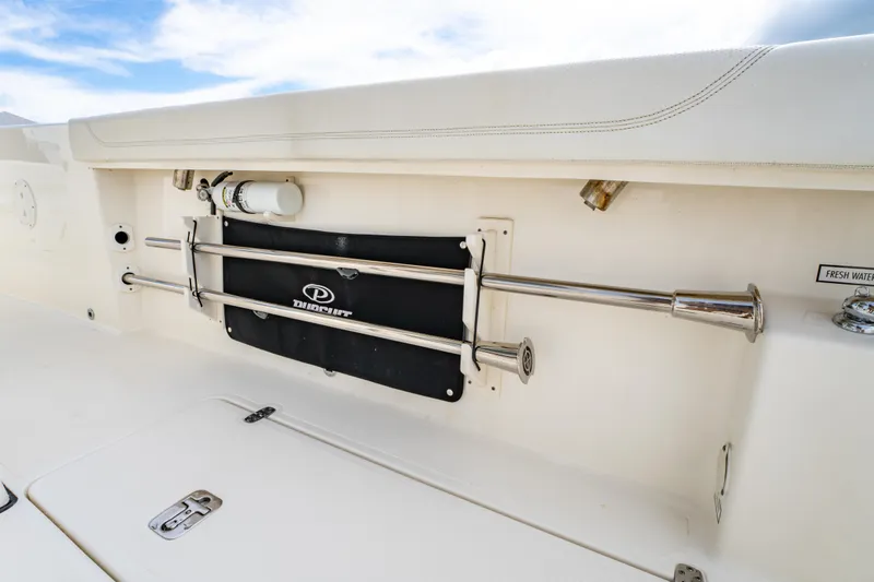 Slide: The Image of 2021 Pursuit S 288 Sport boat interior with stainless steel fittings and storage compartment. - 36