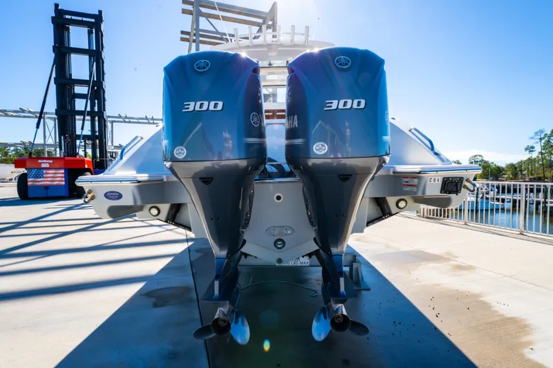 Slide: The Image of 2021 Pursuit S 288 Sport boat with dual 300 horsepower engines at dock. - 39