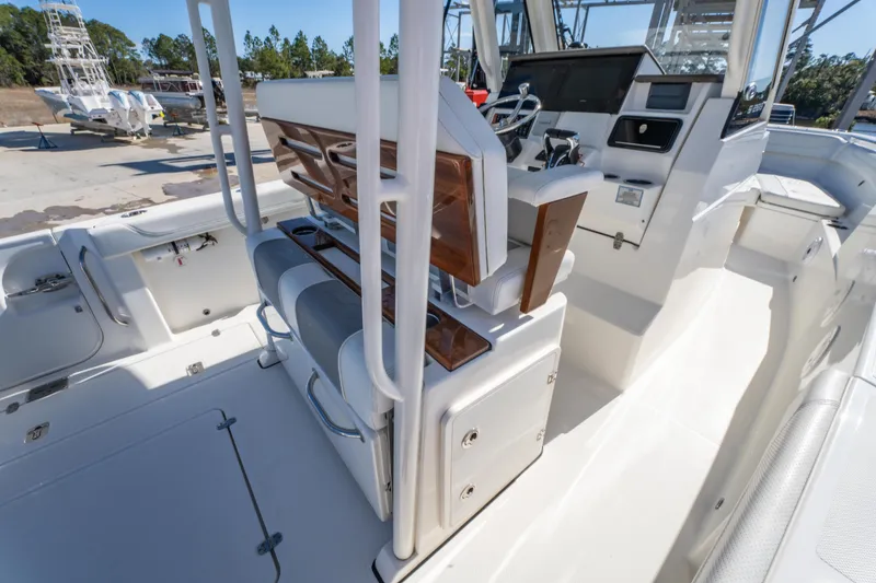 Slide: The Image of 2021 Pursuit S 288 Sport boat interior with helm and seating area. - 46