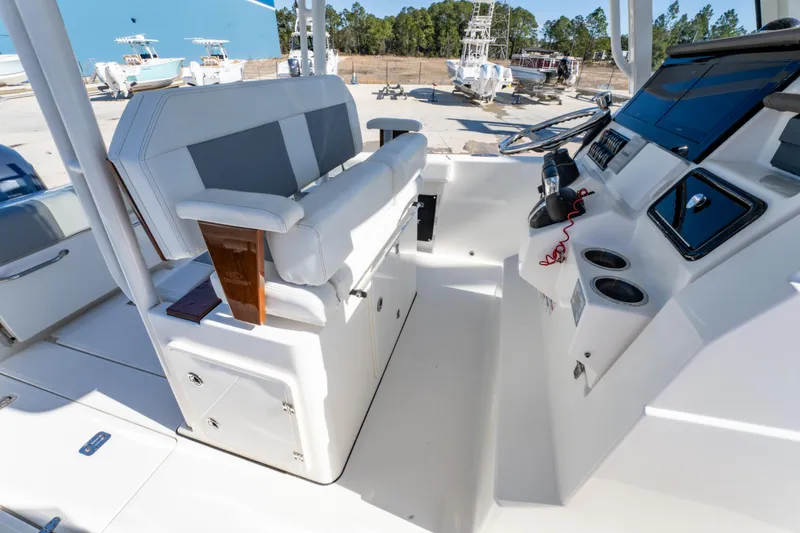 Slide: The Image of 2021 Pursuit S 288 Sport boat interior with helm and seating area. - 47