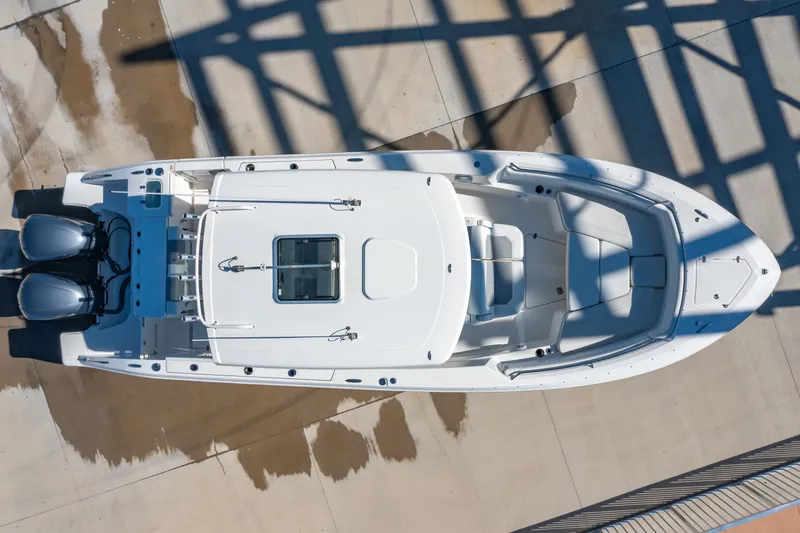 Slide: The Image of Overhead view of 2021 Pursuit S 288 Sport boat on concrete surface. - 52