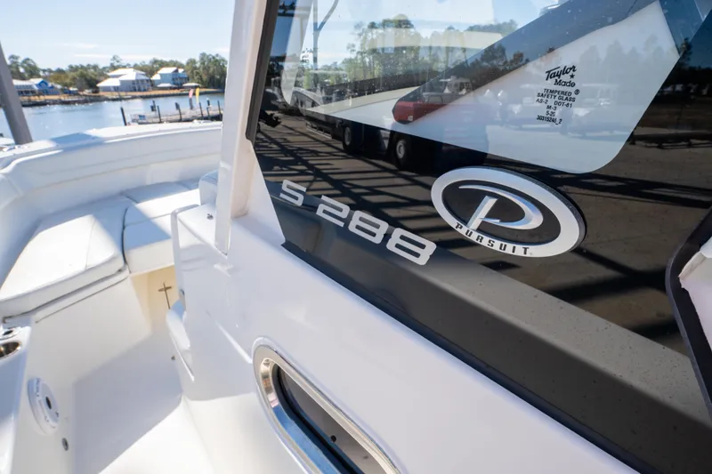 Slide: The Image of 2021 Pursuit S 288 Sport boat, close-up of logo and model name on deck. - 56
