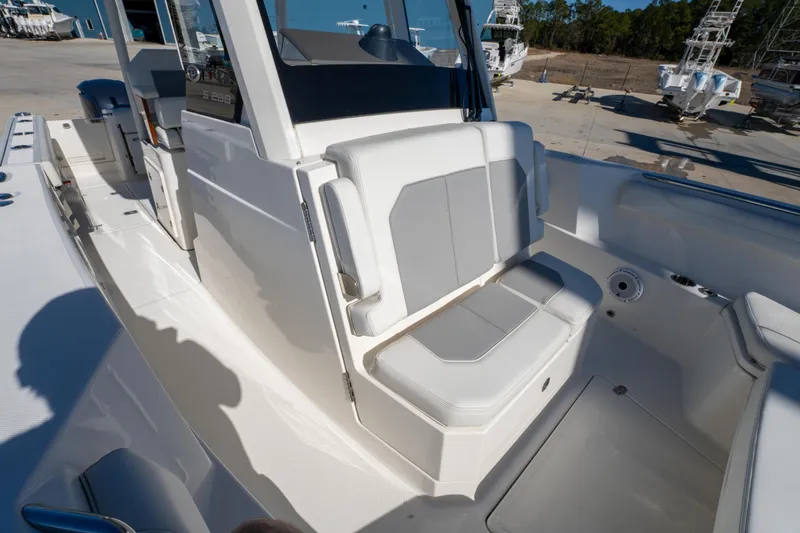 Slide: The Image of 2021 Pursuit S 288 Sport boat interior with cushioned seating and modern design. - 59