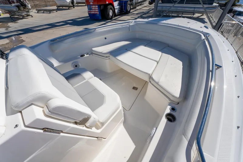 Slide: The Image of 2021 Pursuit S 288 Sport boat interior with white seating and spacious layout. - 60