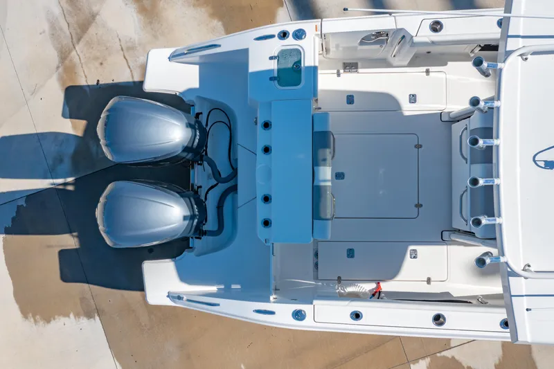 Slide: The Image of 2021 Pursuit S 288 Sport boat, aerial view of deck and dual engines. - 68