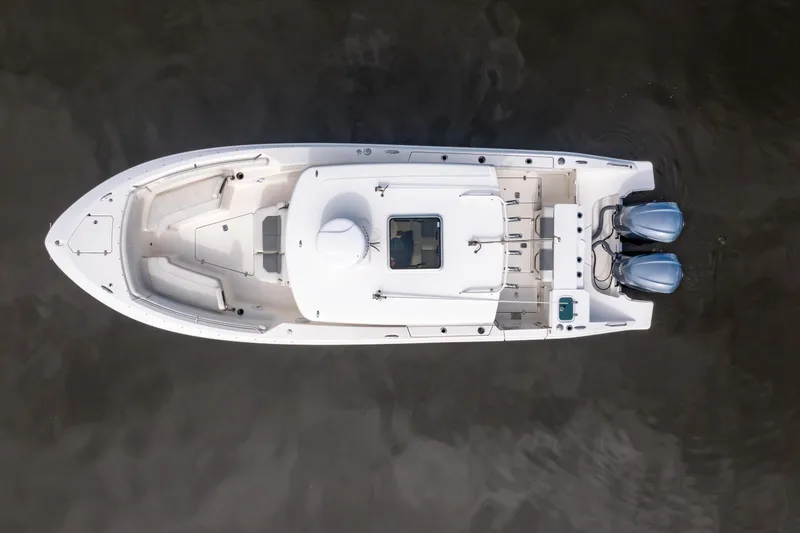 Slide: The Image of Overhead view of 2021 Pursuit S 288 Sport boat with dual engines on water. - 7