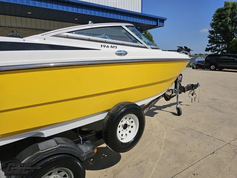Slide: The Image of Yellow 2015 Monterey 196MFS boat on trailer, parked outdoors. - 11